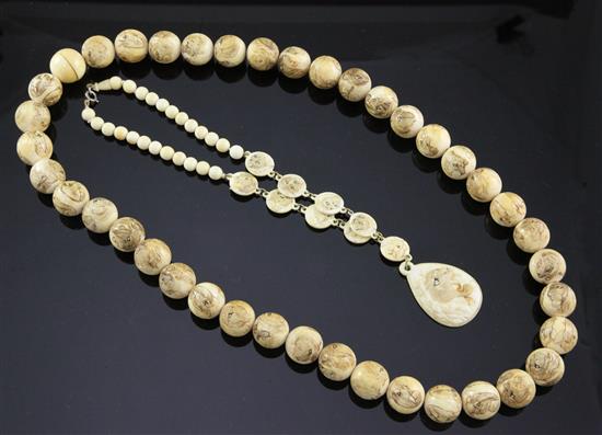 Two Japanese carved ivory necklaces, early 20th century,